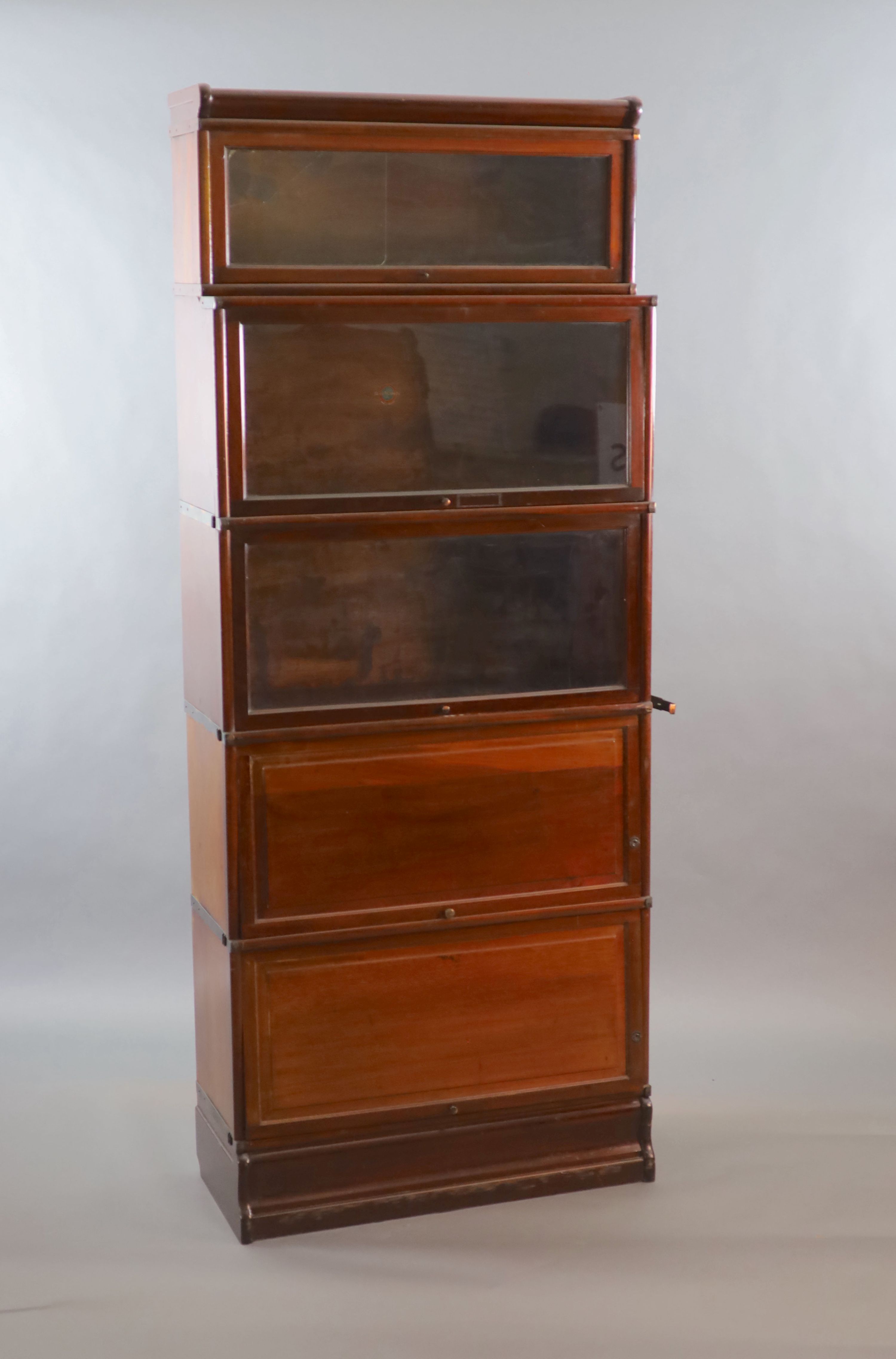 A Globe Wernicke mahogany sectional bookcase, W.86.5cm D.36cm H.216cm.